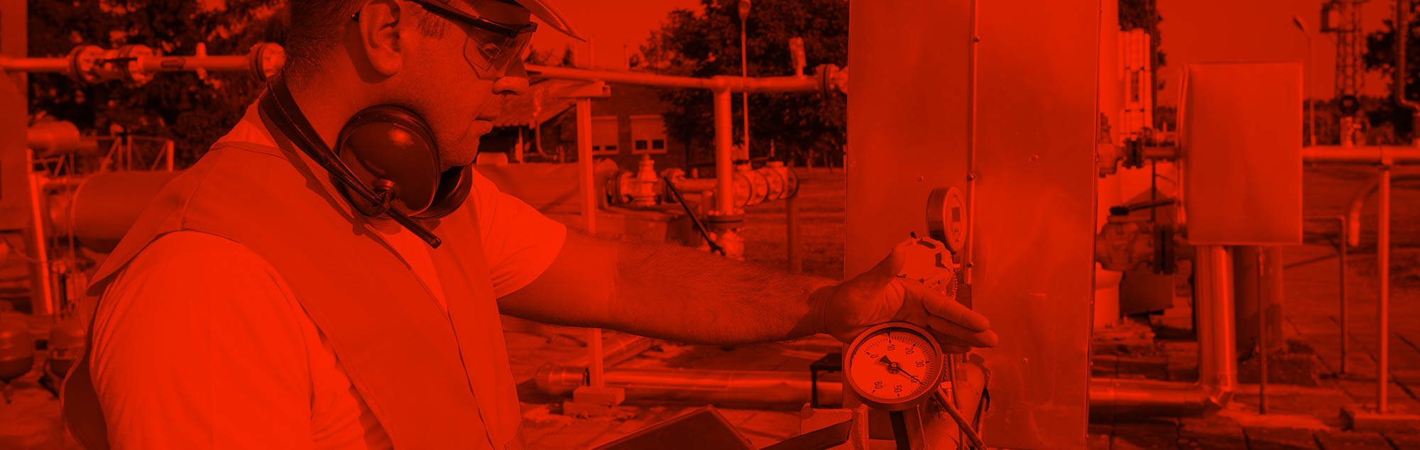 Worker checking readings in red